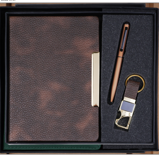 A Jalani Diary gift set in a black presentation box, featuring a brown textured leather notebook, a matching brown pen, and a leather keychain with gold-tone hardware, shown on a white background with the Jalani Diary logo and product number 2026526.
